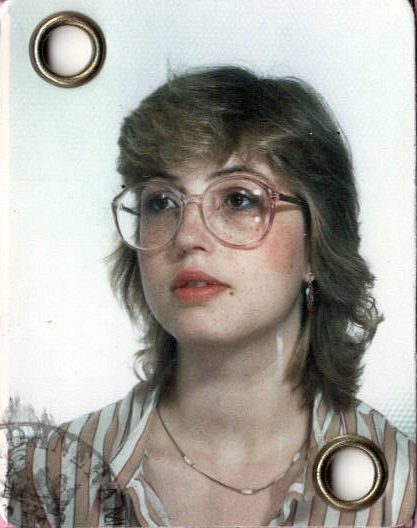 Marlies as a young woman, in large glasses